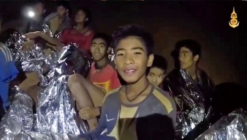 The boys, as seen on July 3, 2018, inside the cave.